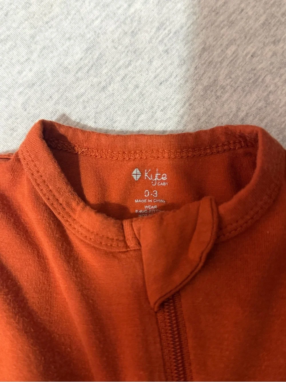 Kyte BABY Rust Orange Zip Footie One-Piece